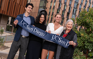 Four people holding a UC San Diego ribbon during the Glass Center opening